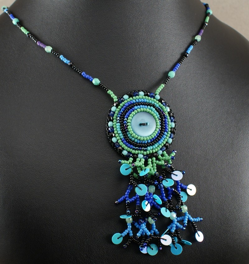 Bead weave with button and sequins on the end of beaded fringes Beads