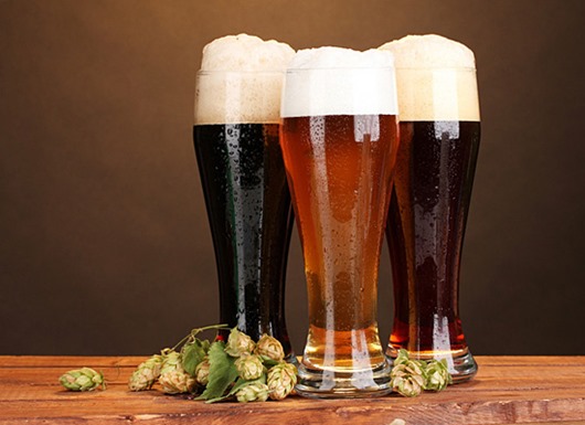 three glasses with different beers and hop