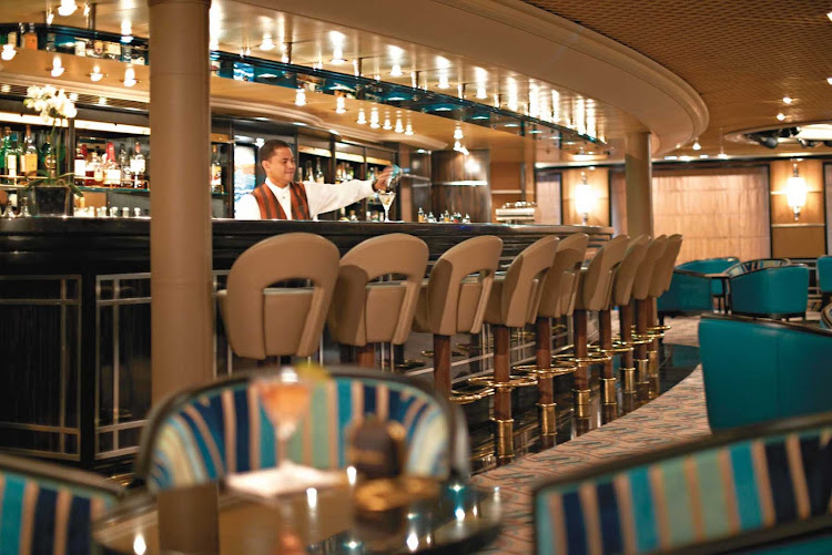 Mingle with other guests at The Bar on Silver Cloud. It features a dance floor, complimentary cocktails and friendly bartenders.