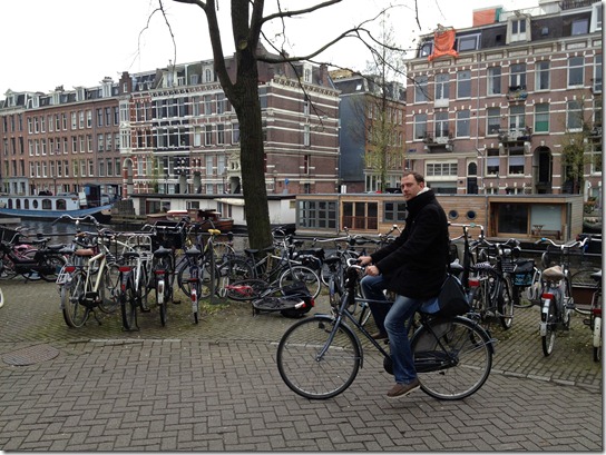 Dirk Eys bicycling in Amsterdam