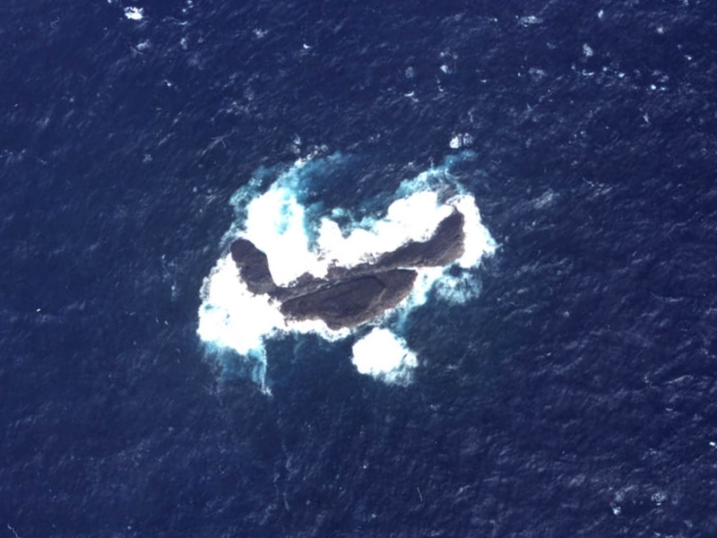 Aerial photo of Oki-no-Minami-iwa (沖の南岩)/Nányǔ (南屿)/Chōng Nányán (沖南岩)/Dà Nán Xiǎodǎo (大南小島)/Nányán (南岩), group of rocks which form part of the Senkaku/Diaoyu Islands disputed between Japan, China, and Taiwan