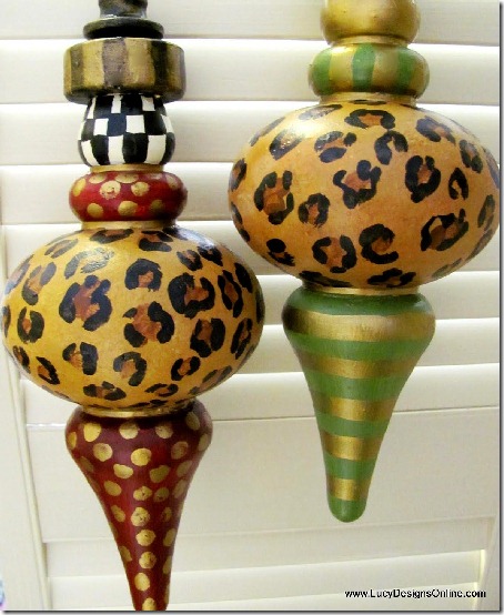 Hand painted ornaments with black and white check, leopard print, gold strips and spots, and various colors.