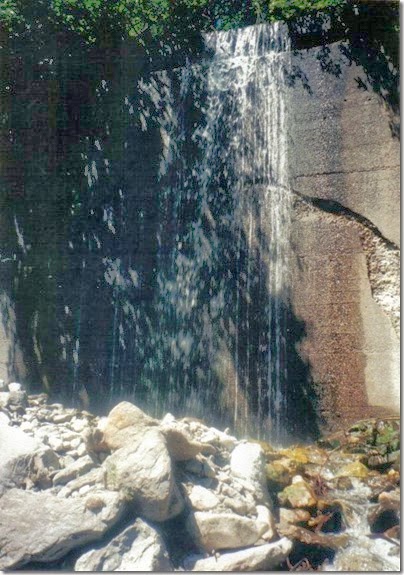 Water cascading over Concrete Snowshed Wall near Milepost 1712 on the Iron Goat Trail in 2000