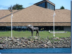 5062 Michigan - Sault Sainte Marie, MI -  St Marys River - Soo Locks Boat Tours - wood carved bull moose on Canadian side