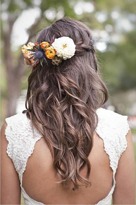 An on-trend waterfall braid, complete with flowers, is an ideal look for bridesmaids