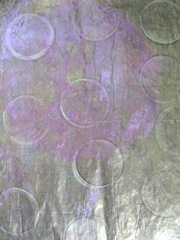 gelli printed papers gold paint w rings then cleared plate