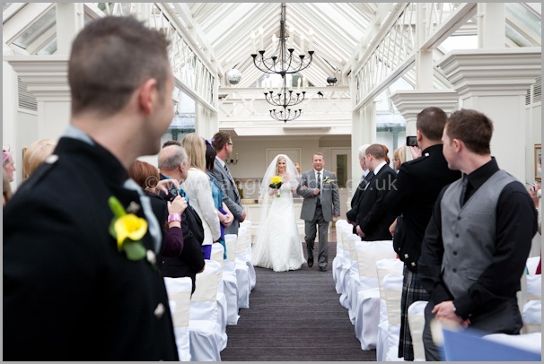 Jo comes down the aisle for her wedding at the landmark dundee
