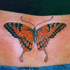 Orange butterfly lower back - tattoos ideas
