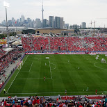 watching the match Toronto FC vs New England Revolution in Toronto, Canada 
