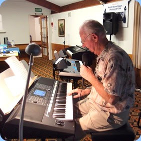 Peter Jackson played both the arrival music and a performance slot. He played some pieces straight and sang along with his Yamaha PSR-S950 for some other numbers. Photo courtesy of Dennis Lyons.