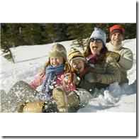 Family Sledding --- Image by © Royalty-Free/Corbis