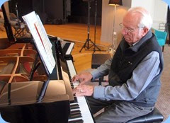 Rob Powell playing the grand piano. Photo courtesy of Dennis Lyons.