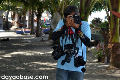 An employee from Sarangani Provincial Hall gamely obliges to take our pictures using all of our cameras! Taken at the Pawikan Nesting Sanctuary in Maitum, Sarangani.