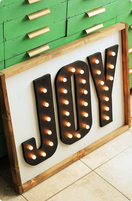 joy marquee sign with Christmas lights