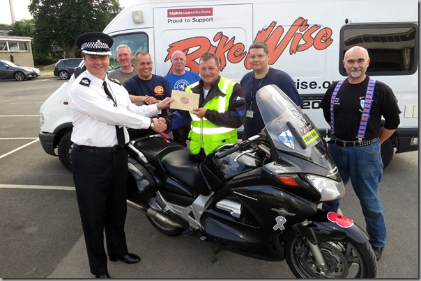 DCC Michael Banks presenting cheque from BikeWise to Paul Carter