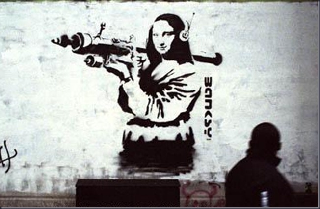 Street graffiti version of the Mona Lisa by underground street artist Banksy in London, England, May 2001.