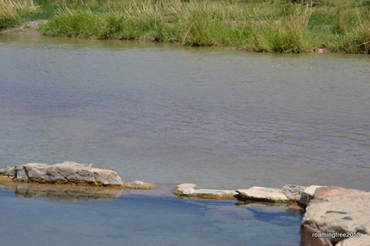 Hot spring at the edge of the river