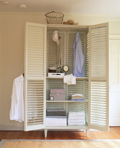 Four large shutters make a breezy and beautiful armoire. (Martha Stewart Living)