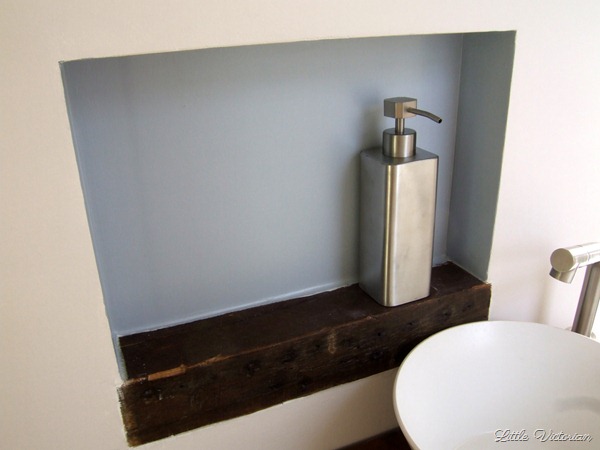 Built in wall cubby in powder room