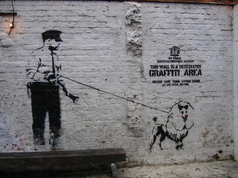 Police_and_Dog_Banksy_Graffiti_by_X_ray_Sez.jpg