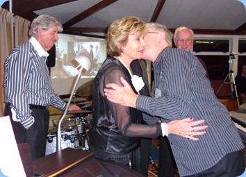 One of the joys of being the MC! Gordon Sutherland showing his appreciation to Carole Littlejohn for coming all the way from Papamoa (near Tauranga) to put on the fantastic concert. Photo courtesy of Club Secretary, Colleen Kerr.