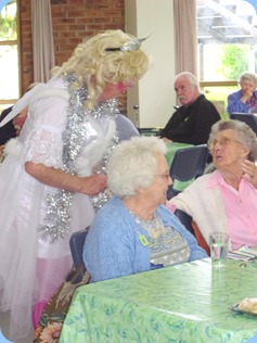 Fiona inviting a 95 years young Prescott Club member to dance