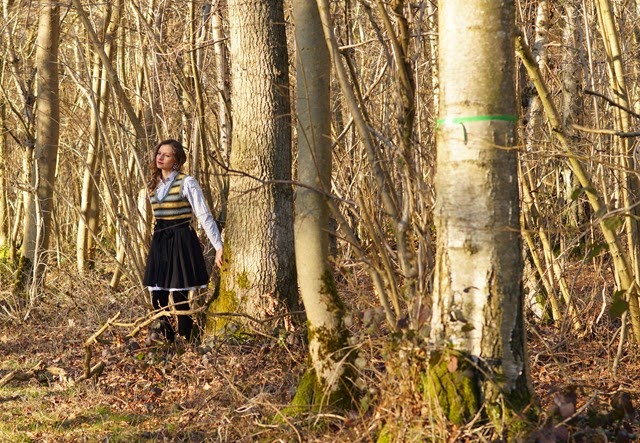 girl in the woods with a lace skirt