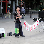 street performer in ueno - it spells: arigatou in Ueno, Japan 