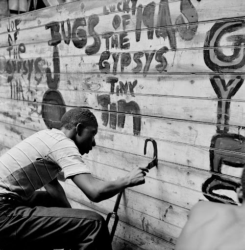 Gang Member Graffitis a Wall, Harlem, New York
