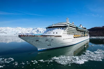 Radiance of the Seas sails through the icy, sparkling waters of  Alaska.
