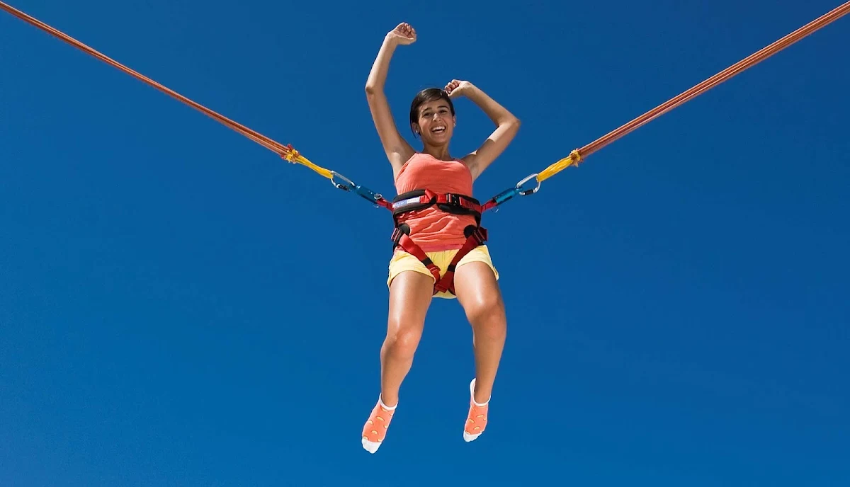 Enchantment-of-the-Seas-bungee - For exhilarating fun, teens, children and adults can try out a bungee jump trampoline at Enchantment of the Seas' Jump Zone.