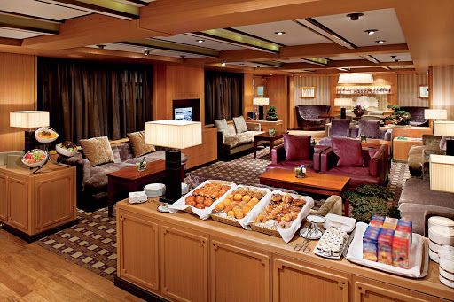 Holland-America-Signature-Class-Neptune-Lounge - The Neptune Lounge on Eurodam offers a private place where guests can relax, socialize with other guests and enjoy personalized concierge service. It comes equipped with a large-screen TV, library, wi-fi, sofas, work tables and refreshments throughout the day.