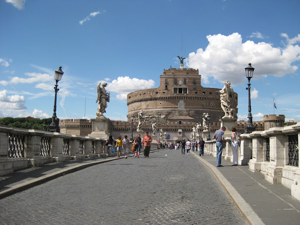 Castel Sant’Angelo across a bridge over the Tiber river.