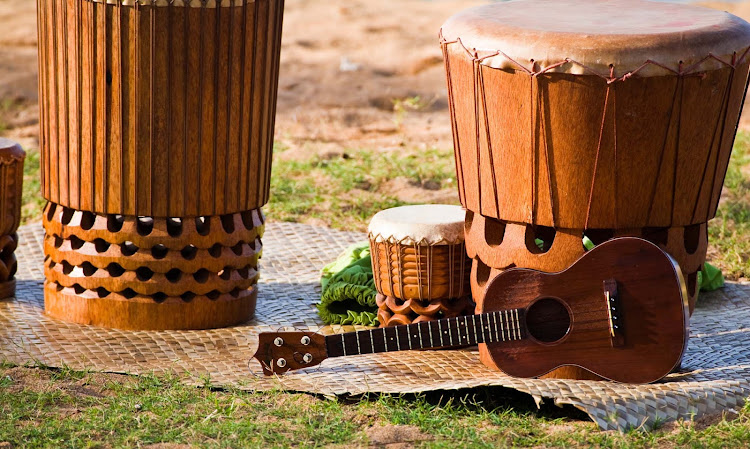 A traditional pahu, or drum, and ukulele on Hawaii. Both are an integral part of Hawaiian music.