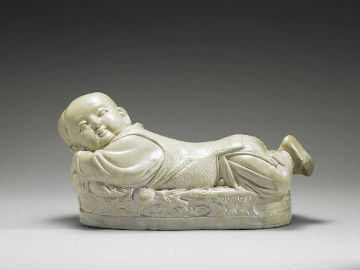 Ting Ware White Ceramic Pillow in the Shape of a Child