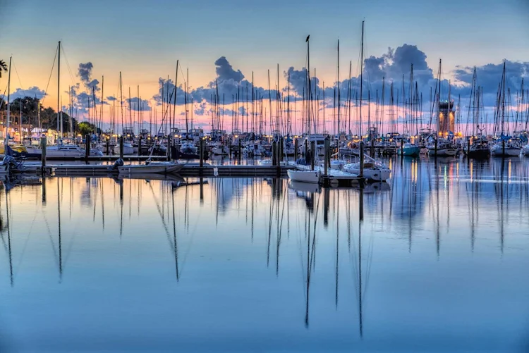 Fishing at sunrise at the pier in St. Petersburg, Florida.