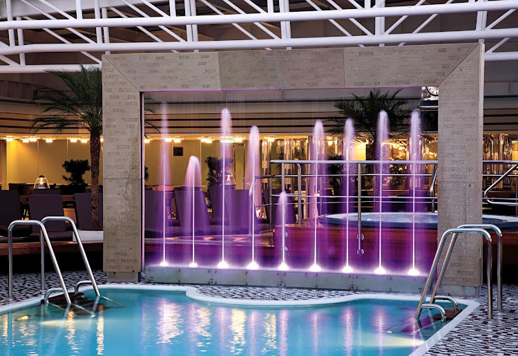 The Lido Pool at midship on Holland America's Eurodam features nine purple fountains that light up at night.