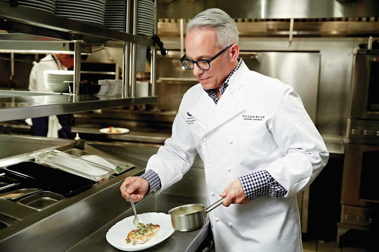 Iron Chef winner Geoffrey Zakarian prepares a sauce in the kitchen of a Norwegian ship. The renowned chef oversees three seafood restaurants: Ocean Blue and the Raw Bar on Norwegian Breakaway and Getaway and Ocean Blue on the Waterfront, on Breakaway.  