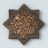 Star-shaped tile with a phoenix and stylized flower spray