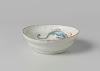 Shallow bowl with a pearl chasing dragon and flowering plants in relief