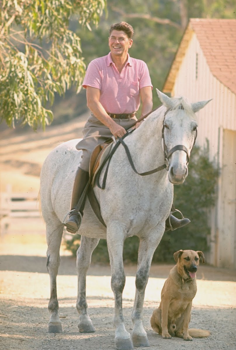 CA gov. candidate Ronald Reagan riding horse outside at home on ranch. 