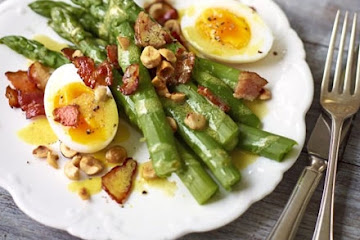 Warm salad of asparagus, bacon, duck egg & hazelnuts