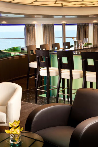 Seabourn_Observation_Bar-3 - Panoramic views greet guests as they gather for early morning risers' coffee and tea in the Observation Bar on Seabourn Sojourn.