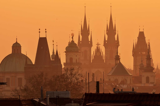 The spires of the Church of Mother of God in front of Týn, often translated as Church of Our Lady before Týn, rise above the Old Town of Prague, Czech Republic.