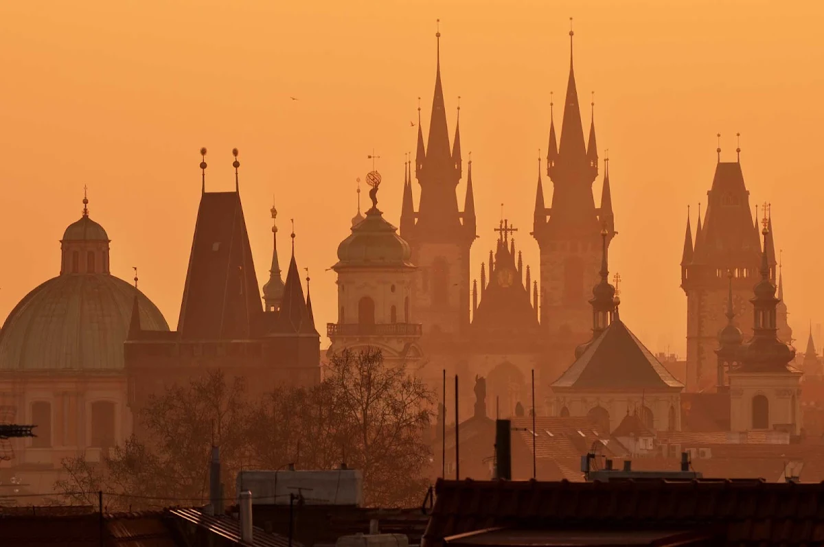 Czech-church-spires - The spires of the Church of Mother of God in front of Týn, often translated as Church of Our Lady before Týn, rise above the Old Town of Prague, Czech Republic.