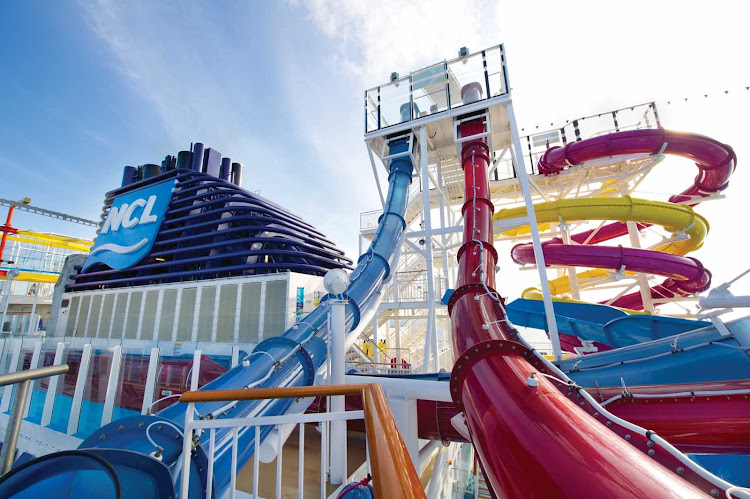 Enjoy a swift drop slide experience inside Norwegian Breakaway's Aqua Park, home to several multi-story slides and pools.