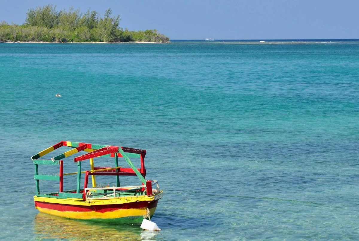 color-boat-Falmouth-Jamaica - A scene along the beach and tropical waters of Falmouth, a popular cruise destination in Jamaica.