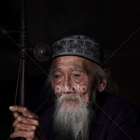 The Old Traditiaonal Musician by Franciscus Satriya Wicaksana - People Portraits of Men