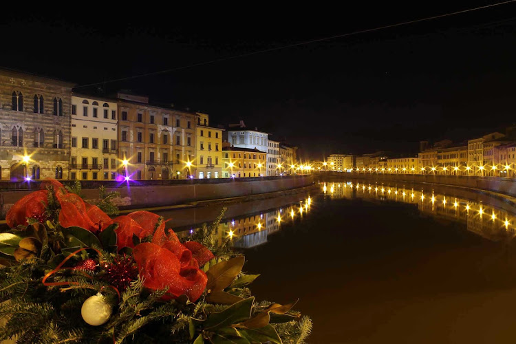 The River Arno in Pisa, Italy, at night.