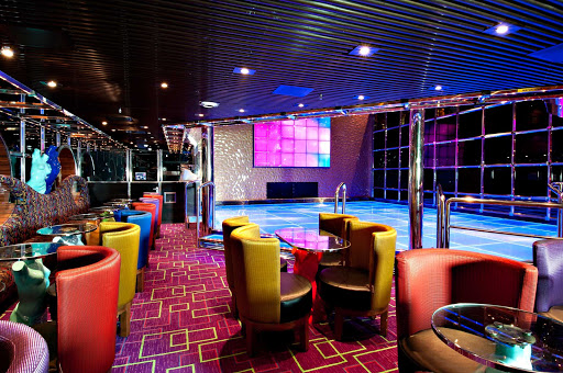 Dance your way across the Caribbean in Carnival Pride's two-story Beauties Dance Club.